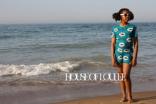 Load image into Gallery viewer, African print childrens shorts in light blue and white stripes with sparrow birds
