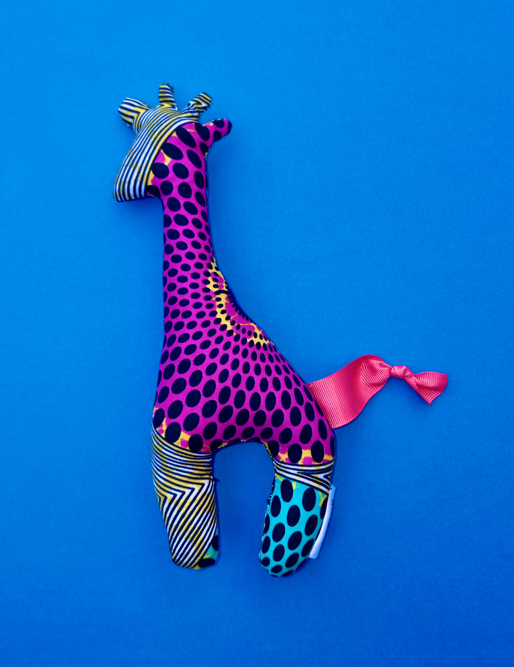 African print giraffe soft toy plush, purple, green, yellow with black spots