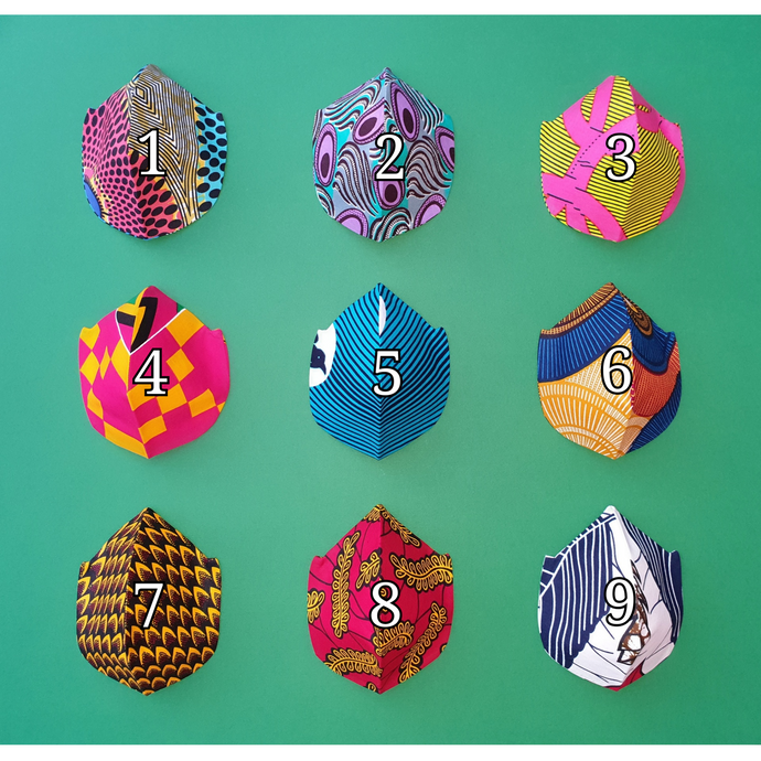african print face mask, 3d mask in 9 colours. 1 pink yellow and green, 2 purple and turquoise, 3 pink and yellow, 4 pink yellow and black, 5 turquoise and white, 6 blue and light brown, 7 yellow and black, 8 yellow and red, 9 white navy and red