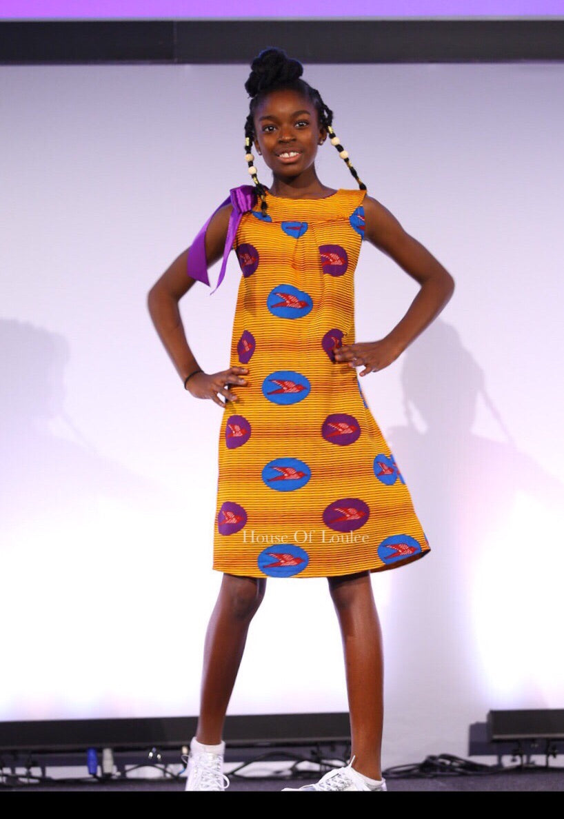 One shoulder ribbon African print dress in burnt orange with blue and purple sparrow birds 